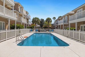 Community Pool just steps from the back patio of this house.