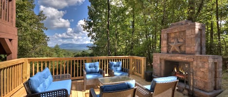 Relax around the outdoor fireplace and take in that huge North Georgia Mountain View!