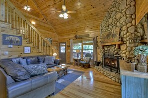 Comfy leather sectional sofa in front of the wood-burning fireplace...plus a view of the mountains