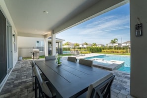 Relax on the spacious patio with dining area and enjoy a refreshing dip in your private pool under the sunny skies.