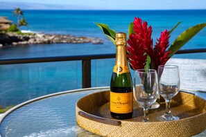 Toast to paradise from your private lanai, where sparkling ocean views and tropical blooms create a picture-perfect dining escape     NAP-C31