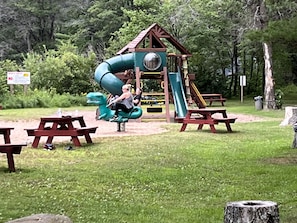 Slides, swings, and tables to sit and watch.
