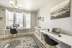 Office with two desks and a couch - ideal for remote workers.