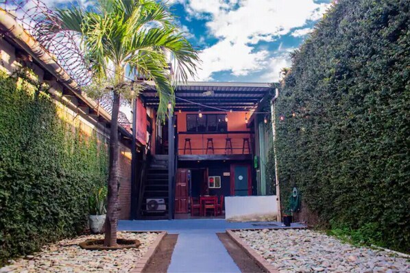 A view of the 2-floor property from the large private backyard. 