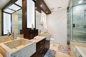 Master en-suite bathroom with dual sinks, huge walk-in shower, with jetted tub. 
