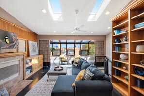 Top level bedroom with beautiful skyline views of the city. Fun area! 