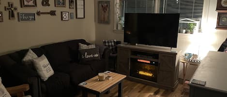 Living Room- Homey, Cozy, and Decorated with my family photos.