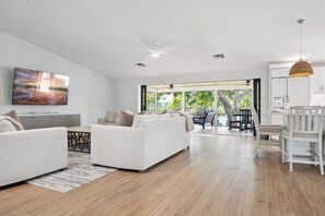 Chic living space opens to the screened lanai