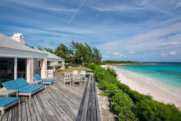 Welcome to Palm Hill, a private beachfront estate on Cotton Bay's pink sand beach.