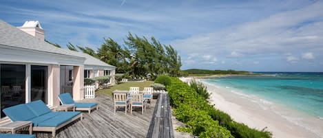 Welcome to Palm Hill, a private beachfront estate on Cotton Bay's pink sand beach.