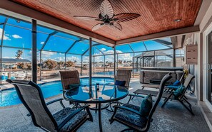Fantastic screened lanai where you can enjoy the view of the pool and the canal