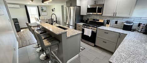 Kitchen comes fully stocked with all essentials. Gas stove, double side fridge, dishwasher, Keurig machine, etc.