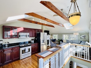 Kitchen looking into living room with gas fireplace