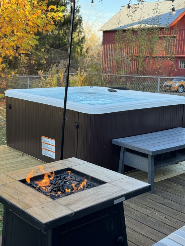 Propane fire pit and hot tub. Seating on the patio for 4