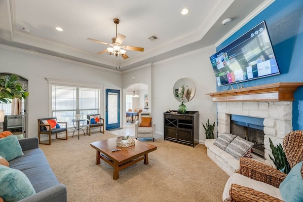 Living room with 70'' Smart TV with apps and YouTubeTV provided