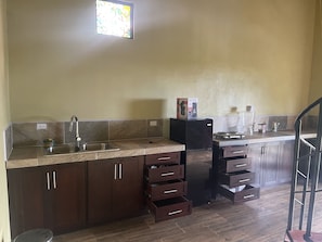 Ample kitchen space. Spiral staircase in the centre 