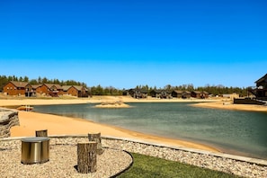 Outdoor wood solo stove fire pit overlooking the 5 acre non-motorized lake.