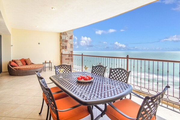Enjoy the stunning panoramic ocean front view on the spacious patio