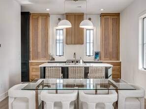 Dining table and kitchen on the first floor