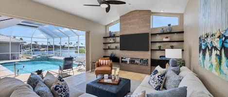 Incredible recently redone family room overlooking the lanai and pool