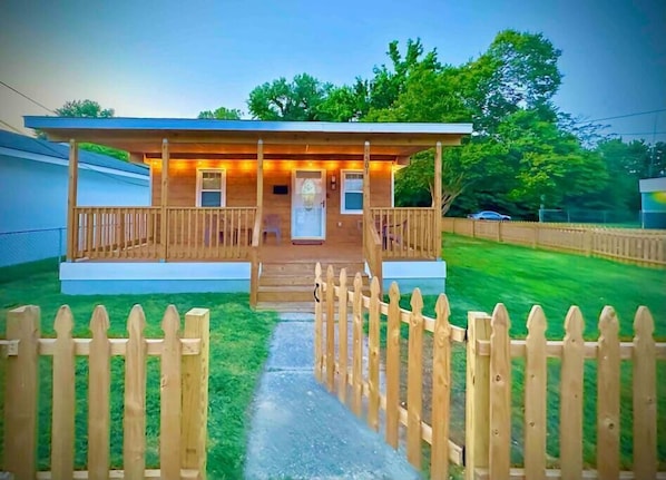Large front deck with lights and private fenced yard