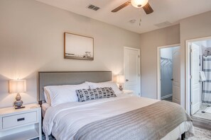 The master has a king bed with crisp, white linens.