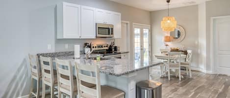 Central to the open floor plan is the fully equipped kitchen!