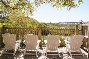 Extend your living space with inviting outdoor seating: a perfect spot to enjoy fresh air and relaxation in your stylish retreat