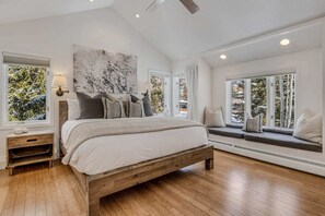 Primary bedroom with comfortable king bed, en-suite bathroom and walk-in closet
