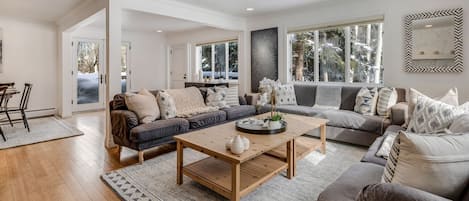 Spacious living room with large, comfortable sofa's