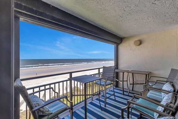 Covered Lanai - - Enjoy oceanfront mornings or sunset cocktails from your private balcony featuring a stylish outdoor set
- Fresh air & panoramic views make this space ideal for relaxing, dining, or simply soaking in the salty breeze
- Beachfront bliss starts right here