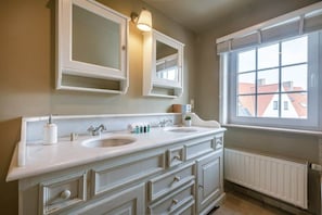 Authentic bathroom with bathtub and shower