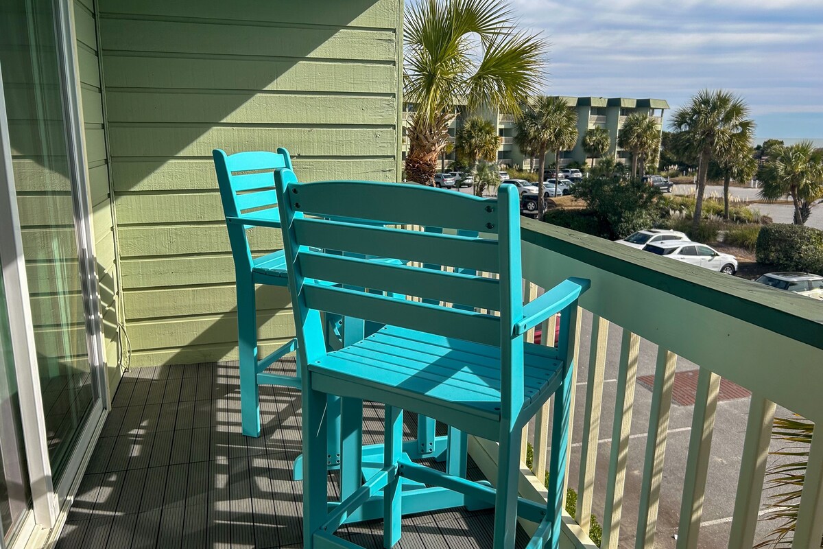 Oceanfront condo with water views, pool, balcony, & easy beach access