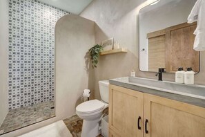 Indulge in a spa-like experience in our luxurious ensuite bathroom, featuring a walk-in shower and all amenities provided.