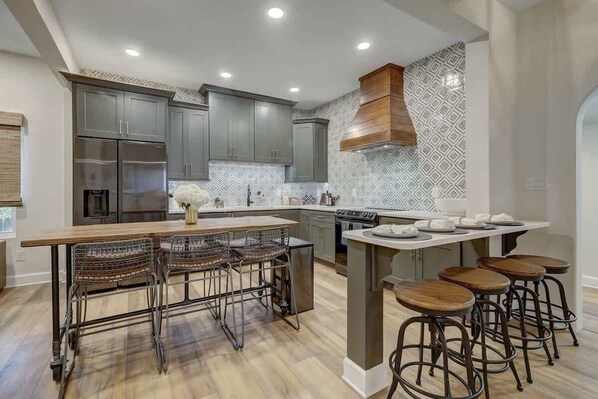 Pull up a seat and savor a delicious meal- complete with sleek barstools - the perfect spot to indulge in good food and great company.  Eating area seats 10