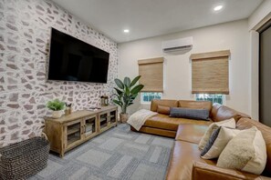 Relax and unwind in style in our beautifully professionally decorated living room, where comfort and luxury come together to create the perfect retreat during your stay.