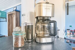 Your morning coffee is eagerly awaiting preparation, crafted from locally sourced and organic coffee beans.