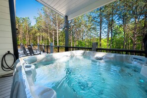 180-degree views of peaceful seclusion while soaking in the brand-new hot tub. 
