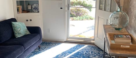 Entry way with glass screen door to let the light in. 