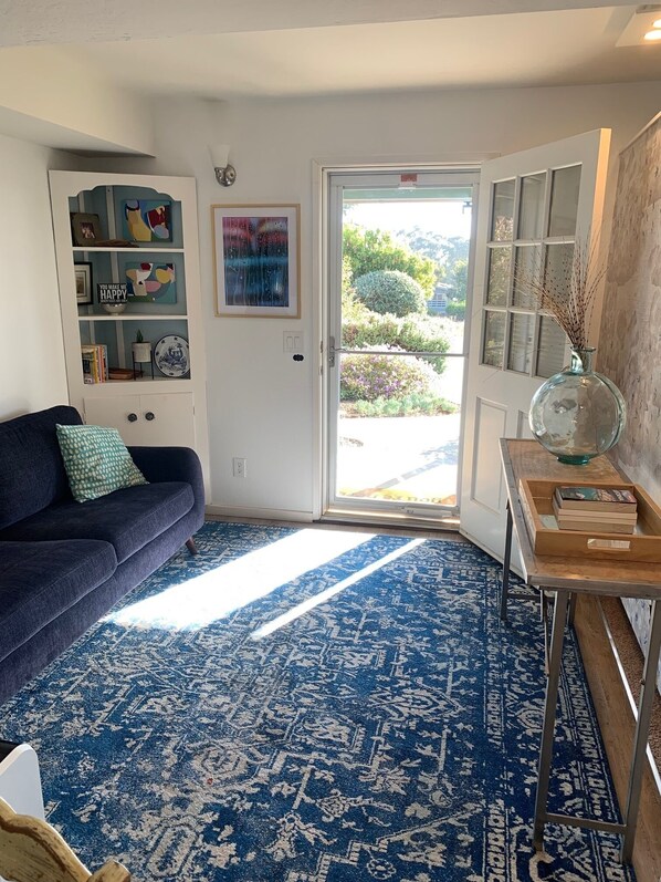 Entry way with glass screen door to let the light in. 