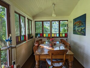 Kitchen table - seats 8., with views of hills through leadlight windows