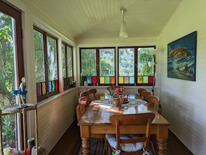 Kitchen table - seats 8., with views of hills through leadlight windows