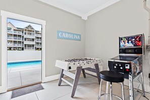 Game room on ground floor with pinball, arcade games, ping pong and foosball