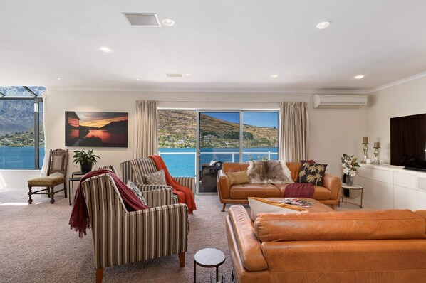 Living Room: Bask in stunning views from plush seating, perfect for relaxation after adventures!