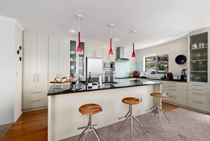 Gourmet Kitchen: Whip up culinary delights with stunning views and chic modern finishes!