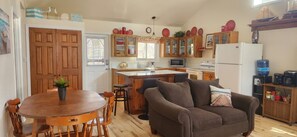 Open concept kitchen/living room. Table for 6, Island seating for 6.