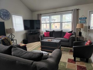 Open concept living room with cathedral ceiling