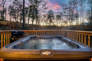 7 person Hot Tub! With nearby propane (provided) grill. Picnic table seating just three steps down next to the fully illuminated deck.