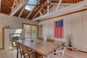 Enter into an open, sunny living & dining area, with Bedroom #3 on right.