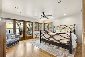 This master bedroom boasts a direct balcony overlooking the serene Lake Belton!